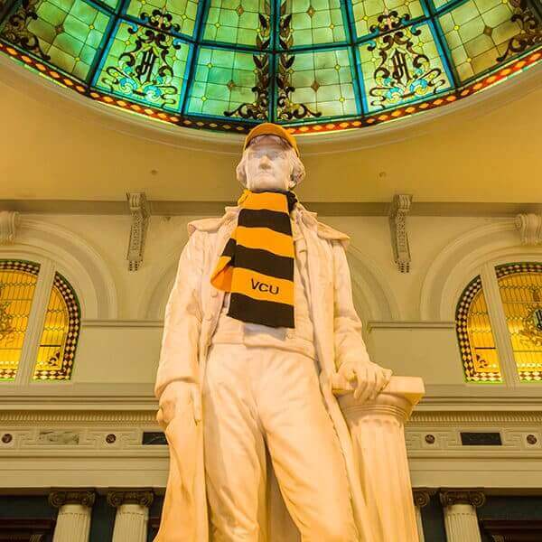 Statue wearing VCU scarf.