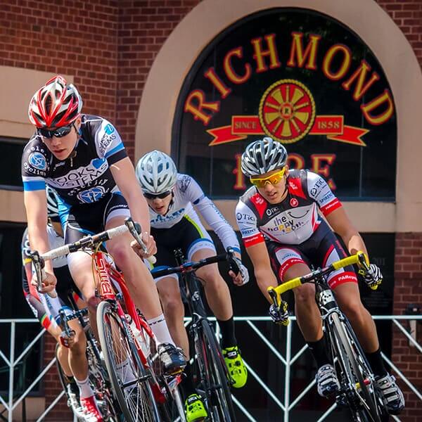 Cyclists passing Richmond fire station.