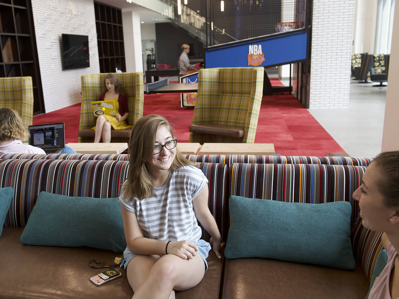 Students having a conversation in a social space