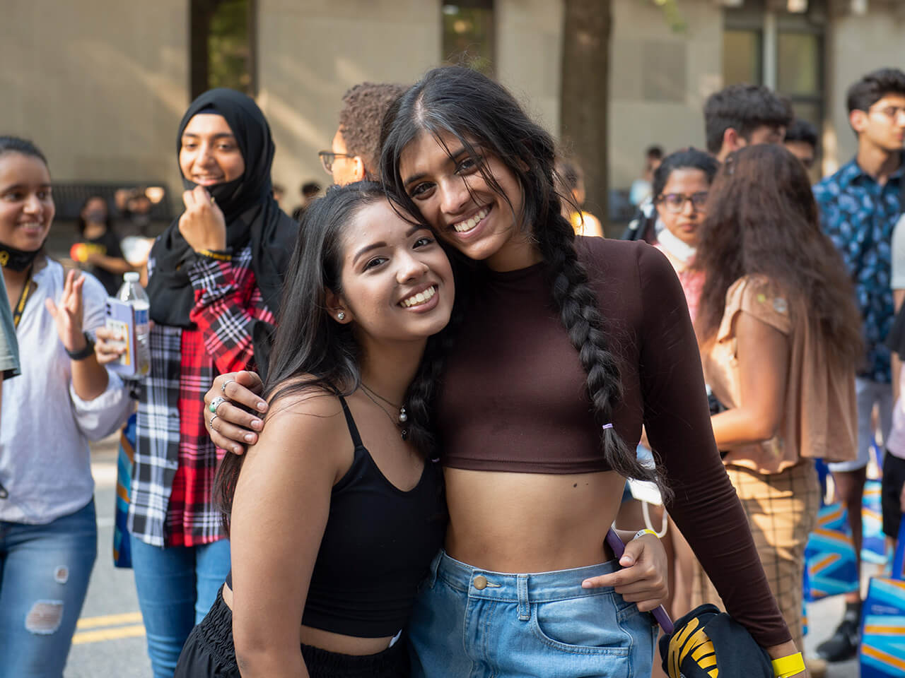 Students enjoying an outdoor event and smiling