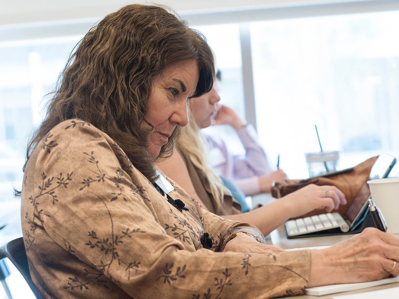 Woman sitting working at a desk