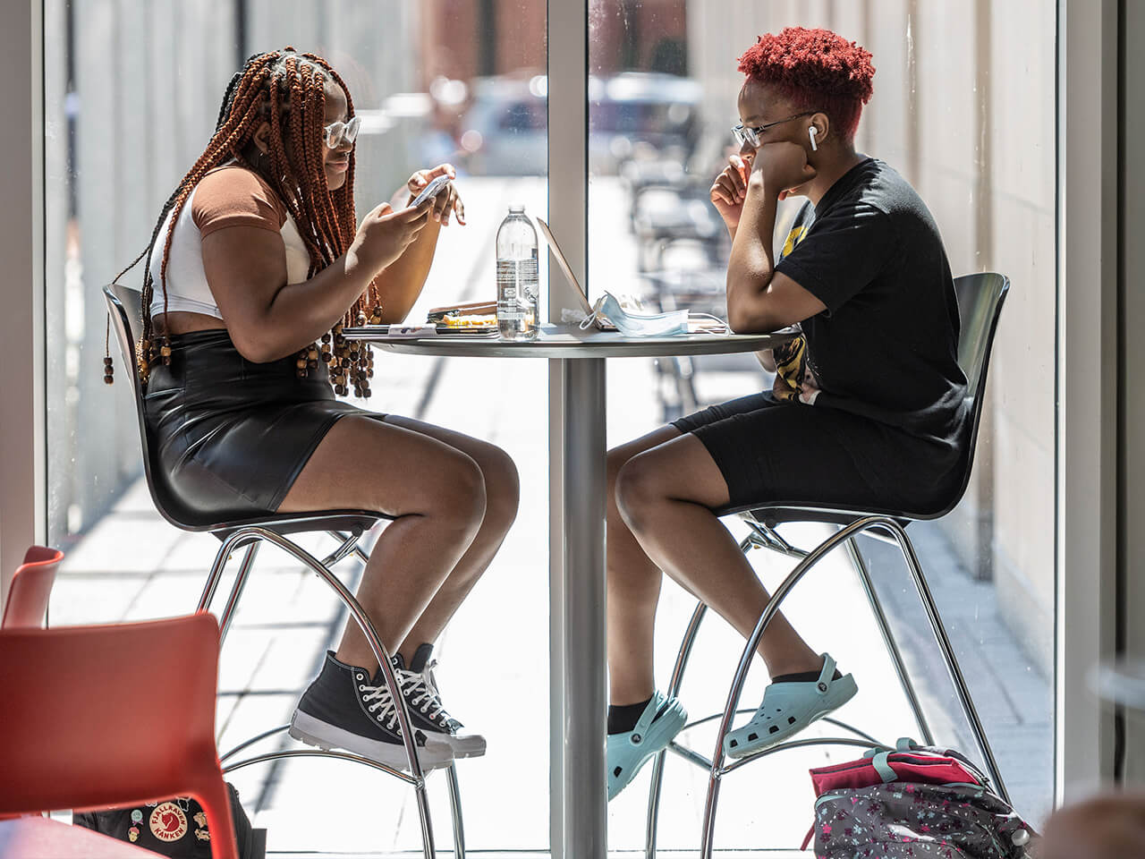 Students sitting together at a table in the library