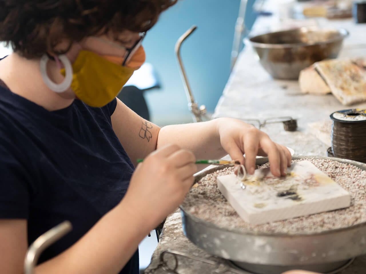 Student working with their hands on a creative project