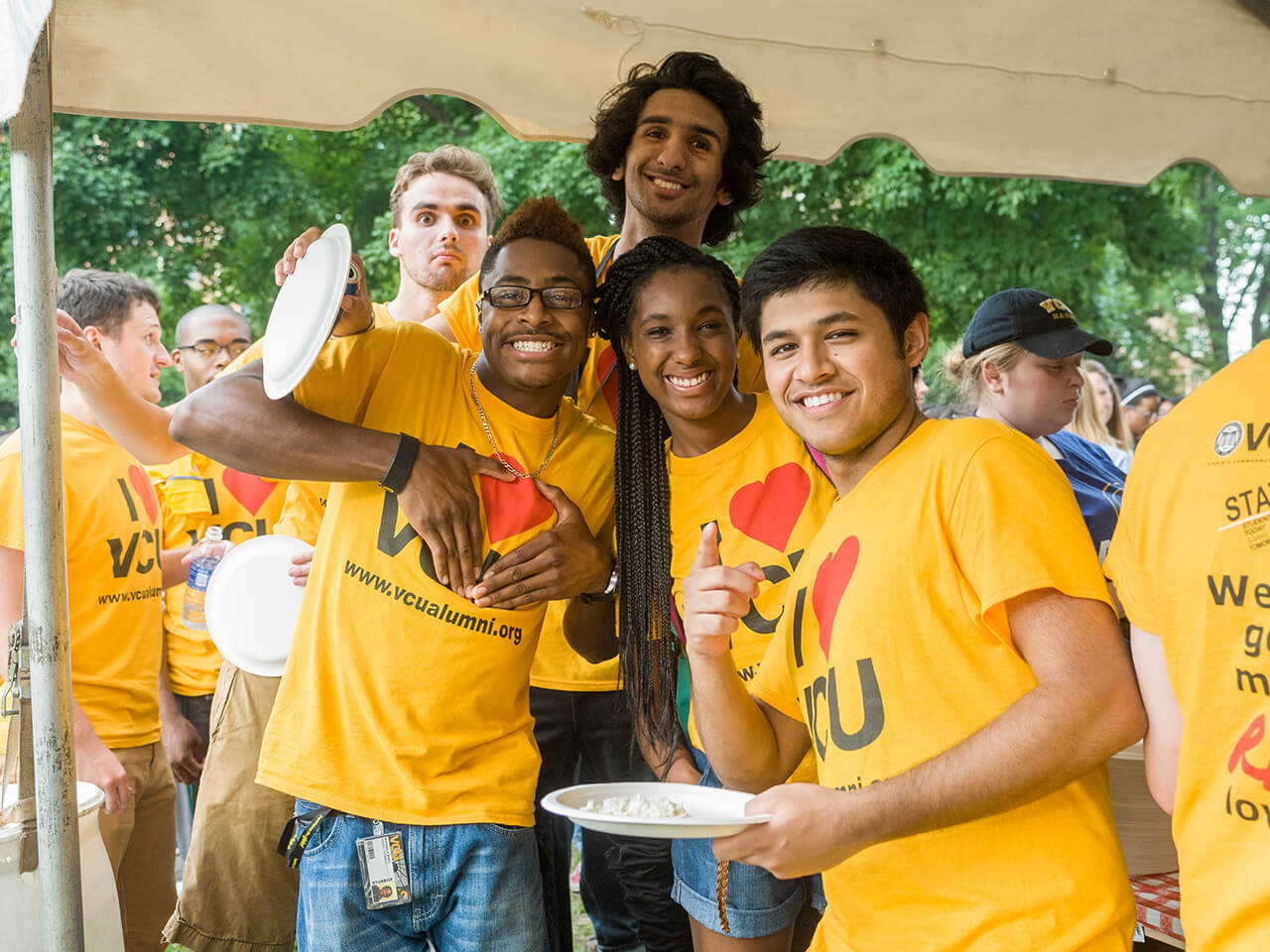 Group of students wearing vcu colors pose for a photo