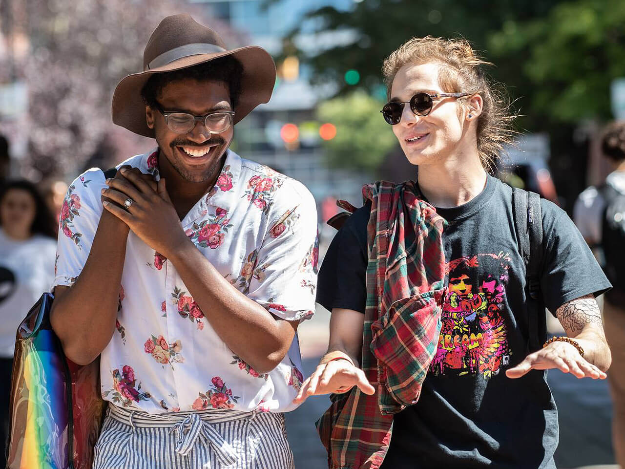 Two males students walking together on a sidewalk